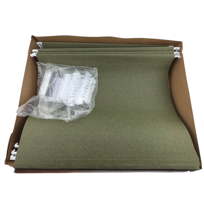 Green folder in a brown bpx and clear plastic packaging on a white background